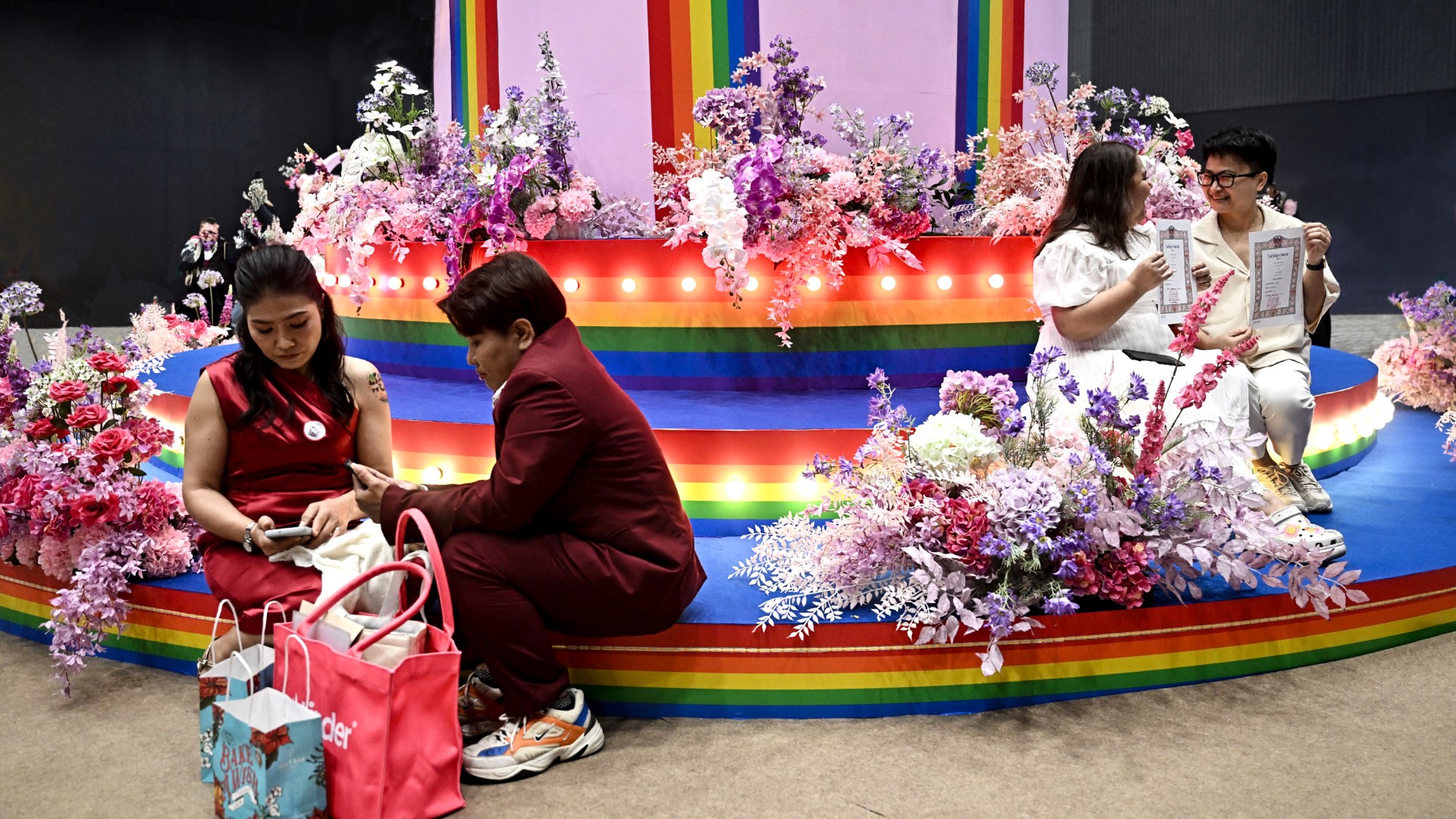 Couples attend their wedding at a marriage registration event at a shopping mall in Thailand.